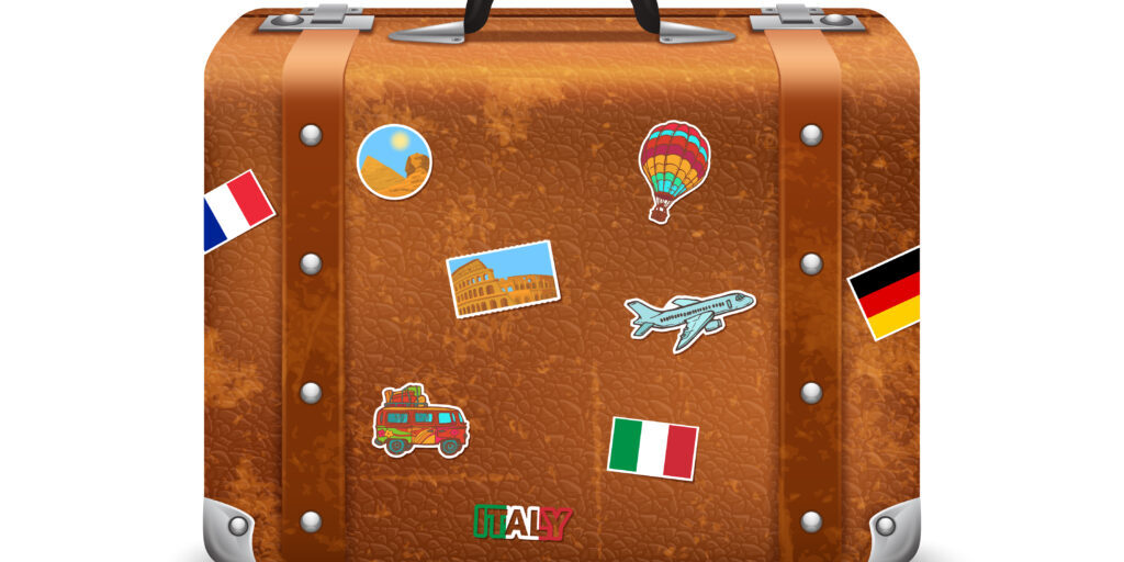 Old style voyage suitcase with travel stickers realistic vector illustration